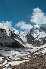 Hiking on the Snowfields of Indian Himalayas with the high altitude panoramic view of higher mountains in mountaineering - 362802269
