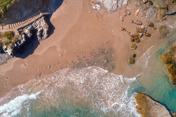 Rocky sea coast and beach. Top view. Abstract landscape. Beach Playa de Las Catedrales in Ribadeo, Galicia, Spain