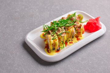 Fresh maki and nigiri sushi rolls with tuna fish and cheese. Asian Japanese cuisine concept.