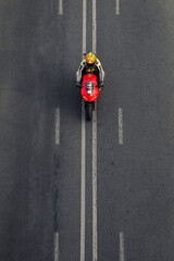 Riding a Ducati on the highway track from an aerial view the top view of bike - 362804835