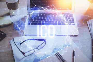 Double exposure of blockchain and crypto economy theme hologram and table with computer background....