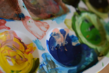 Paint pot aquarel watercolor paints with water and color applied with a paint brush