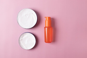different items of beauty industry on pink background. minimalism style. flat lay