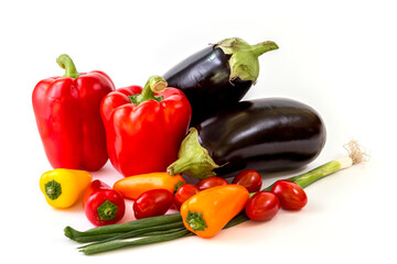 Healthy food, vegetable, paprika, eggplant, tomatos and scallion on a white background