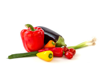 Healthy food, vegetable, paprika, eggplant and tomatos on a white background