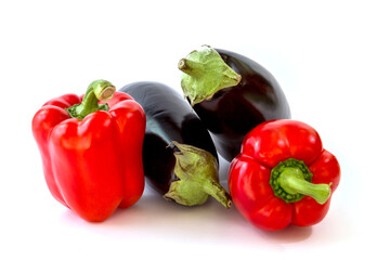 Healthy food, vegetable, paprikas and eggplants on a white background
