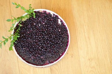 Fresh flat lay of blue berry or bilberry pie
