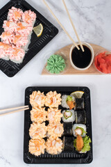 Sushi roll set with yellow cream sauce and shrimp