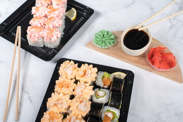 Sushi roll set with yellow cream sauce and shrimp