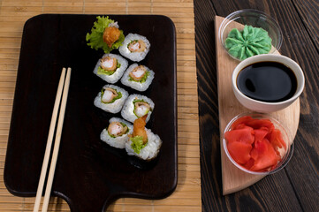 Sushi roll set with salad and fried shrimp