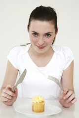 Woman getting ready to eat her cupcake