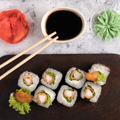 Sushi roll set with fried shrimp and salad