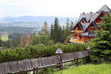 Guest house in the traditional mountain style and mountain landscape. Not far from Zakopane. Tatra mountains. Poland.