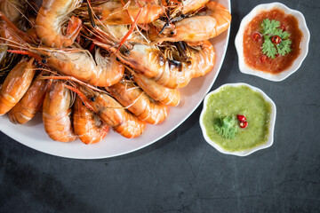 Grilled river prawns in a white plate.