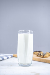 glass of milk and oatmeal cookies with chocolate, copy space