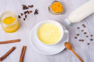 moon milk with turmeric, yellow Vedic milk with spices, honey, cinnamon, anise and pepper, vegan food