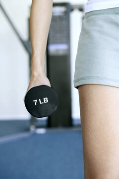 Woman Holding A Dumbbell