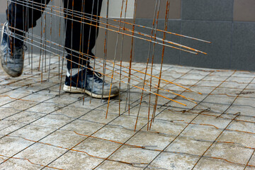 Steel wire mesh lying on concrete before pouring the cement floor.