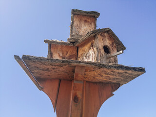 Handmade bird house sky background