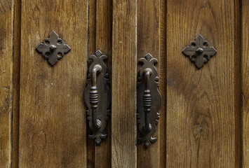 Old brown wooden door with lock