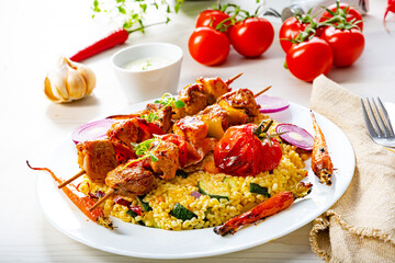 Shish kebabs with vegetables and bulgur
