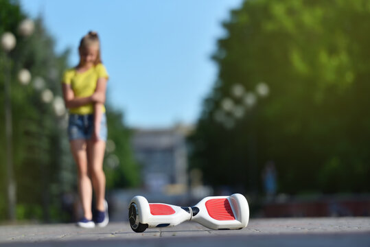 Girl Child Hurt Her Hand While Falling From A Hoverboard While Riding In A Park