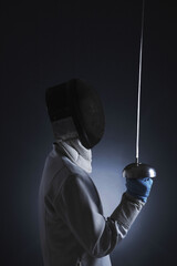 Man holding a fencing foil