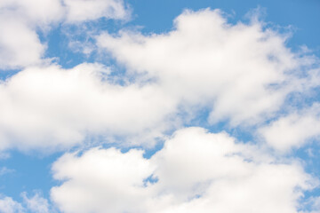 Summers day fluffy clouds with blue sky