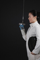 Woman with fencing foil