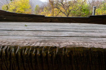 Fototapeta premium Wooden table in the old style close-up.