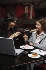 Businesswomen toasting wine