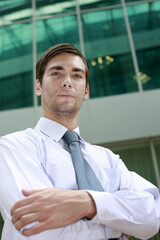 Businessman looking at the camera with his arms folded