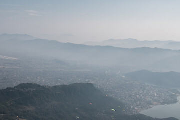 View of paragliders over Pokhara, Nepal from Sarangkot hill