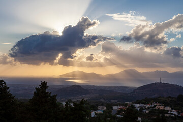 Sunset view with clouds and sun rays from Zia Village, in Kos, Greece.