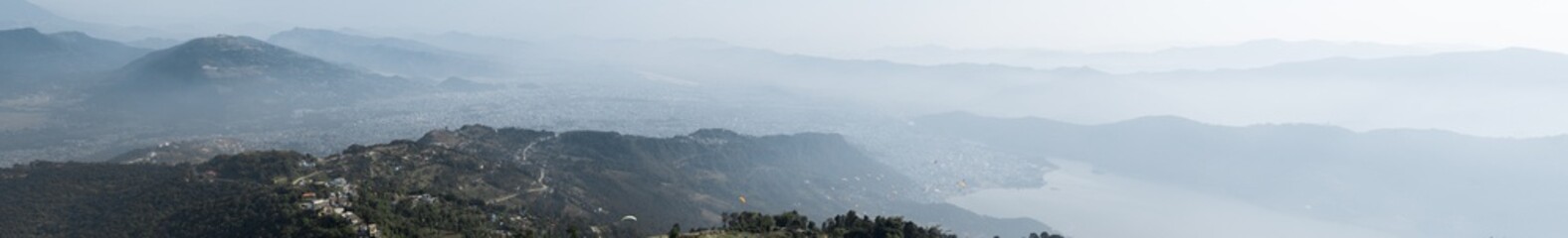 Panoramic view of paragliders over Pokhara, Nepal from Sarangkot hill