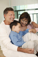 Obraz premium Man, woman and boy embracing