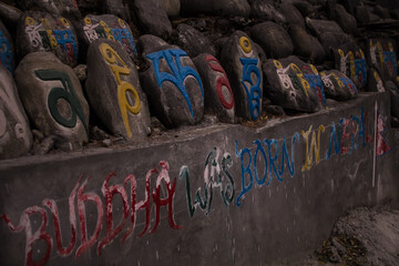Buddha was born in Nepal, colorful religious engraings in stone, Annapurna circuit, Nepal