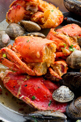 Surf ‘n Turf, lobster tail and steak entree. Filet mignon topped with chanterelle mushrooms & Maine lobster tail topped w/ drawn butter served on white dinner plate. Classic steakhouse menu favorite.