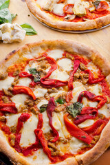 Pizza. Traditional New York City style margarita pizza pie with a thin homemade crispy crust, fresh tomato garlic marinara sauce topped with buffalo mozzarella cheese and fresh basil leaves.