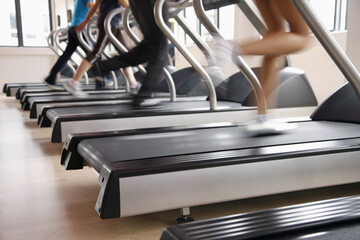 Fototapeta premium Women running on treadmills