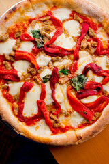 Pizza. Traditional New York City style margarita pizza pie with a thin homemade crispy crust, fresh tomato garlic marinara sauce topped with buffalo mozzarella cheese and fresh basil leaves.