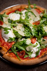 Pizza. Traditional New York City style margarita pizza pie with a thin homemade crispy crust, fresh tomato garlic marinara sauce topped with buffalo mozzarella cheese and fresh basil leaves.