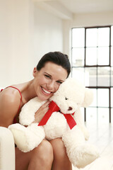 Woman hugging a soft toy