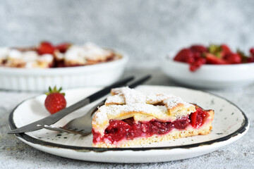 Cake with cherries and icing sugar on a concrete background. Sliced Cherry Pie.