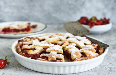 Cake with cherries and icing sugar on a concrete background. Sliced Cherry Pie.
