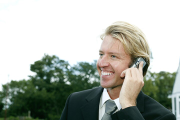 Businessman smiling while talking on the phone