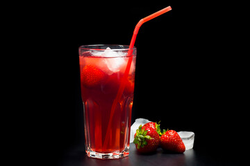 A cool summer lemonade on a black background. Strawberry lemonade.