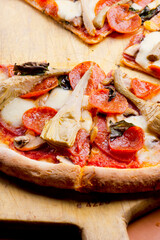 Pizza. Classic traditional Italian entrée favorite. New York Style Pizza with marinara sauce and topped with mozzarella cheese, meats and fresh vegetables. Baked in wood burning oven
