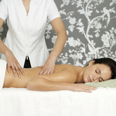 Obraz na płótnie Canvas Woman enjoying a relaxing body massage