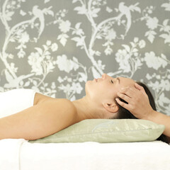 Obraz na płótnie Canvas Woman enjoying a head massage